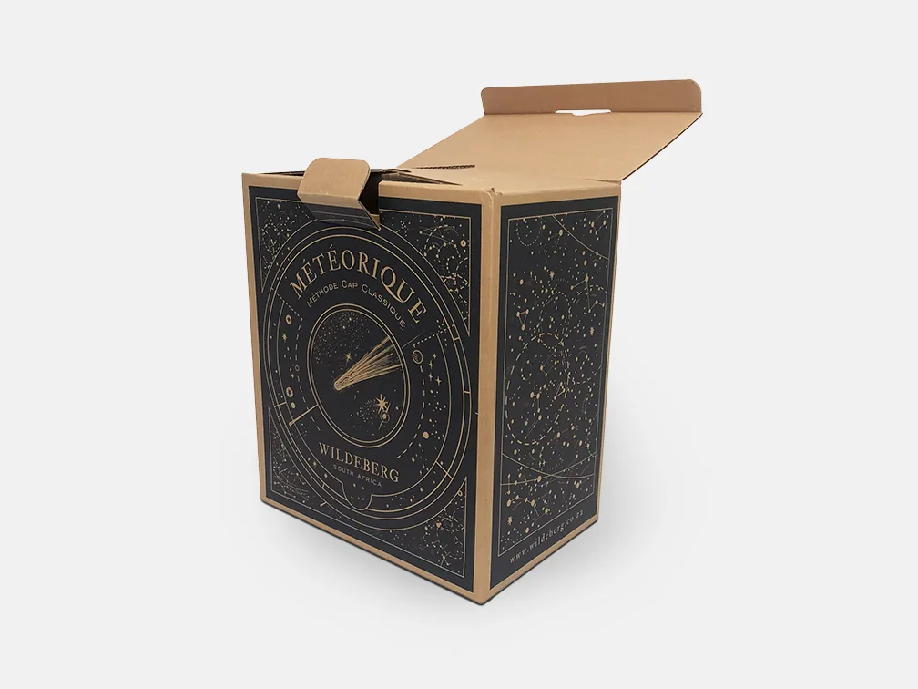 Meteorique box from Wildeberg, navy with gold celestial line work on kraft